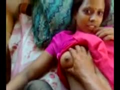 A submissive, authentic Indian slutwife with dark complexion wearing a fiery crimson attire